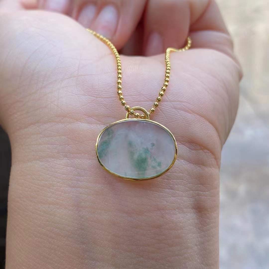 Oval Shaped Jade Pendant - 18k Gold